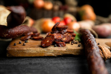Smoked, aged sausages with fresh vegetables and food ingrediets