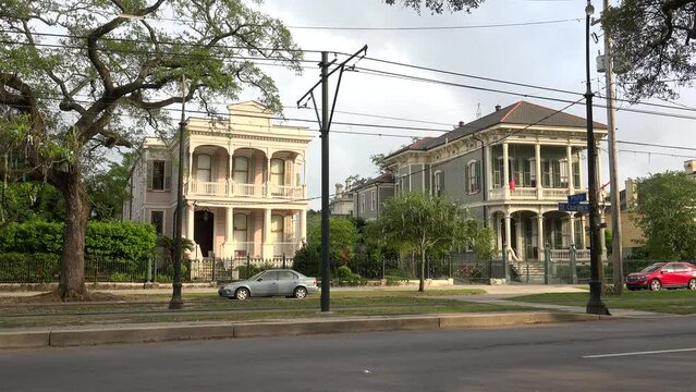 Road traffic at the St. Charles Avenue with Streetcar  (Garden District). New Orleans, Louisiana, USA