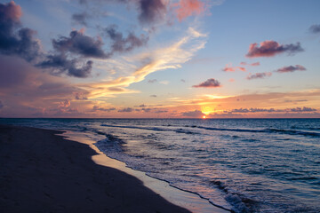 Beautiful colored cloudy evening sky.  Seascape.