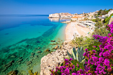 Dubrovnik. Banje turquoise beach and historic city of Dubrovnik view