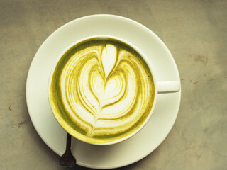 hot green tea and smartphone next to windown relaxing and rest time