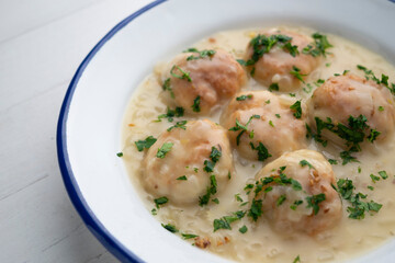 Hake meatballs with onion sauce. Traditional Spanish recipe.