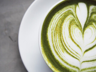 hot green tea and smartphone next to windown relaxing and rest time