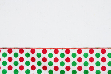 Christmas background with red and green polka dots white sparkles felt