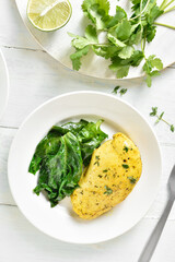 Baked turmeric chicken breast and sauteed spinach
