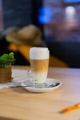 macchiato coffee in glass at cafe
