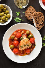 Cod stew with chickpeas, cherry tomatoes and olives