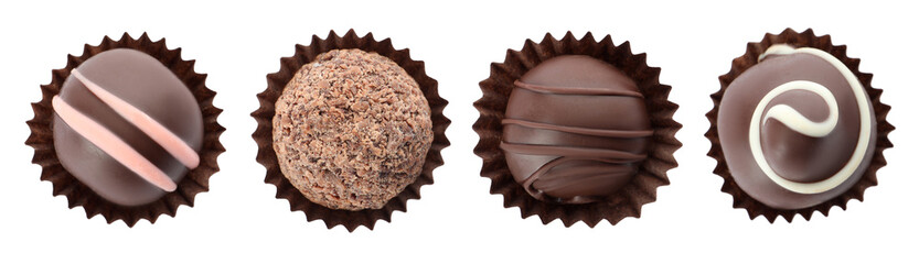 Set with delicious sweet chocolate truffles on white background, top view. Banner design