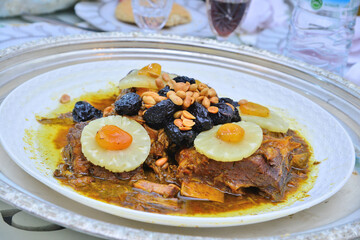 Meat dish with plum, dried pineapple and almonds. One of the most famous Moroccan dishes