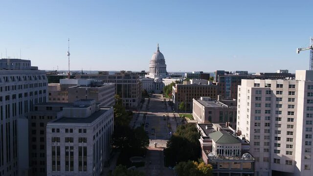Drone Flying From Madison State Capitol Building Pulling Back Over Lake Monona (Pull Back)