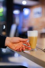 macchiato coffee in glass at cafe
