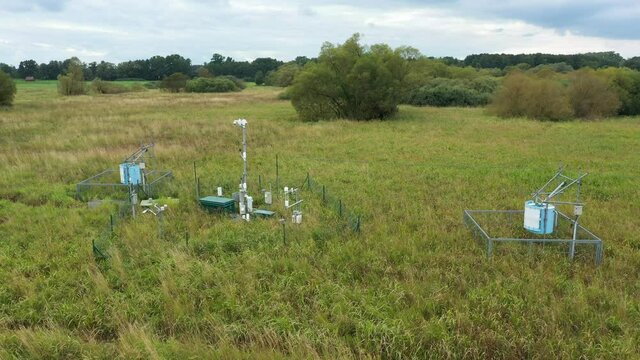 Station science research for studying wetlands meadows, drone aerial video shot ecosystem weather station swamp willows cycle carbon flux eddy covariance methane research physiological photosynthesis