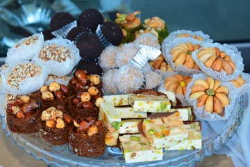 Fotobehang Oriental tea tray and cookies symbolising Moroccan hospitality, Islamic holidays food with decoration. Ramadan kareem. Eid mubarak. Oriental hospitality concept.   © issam