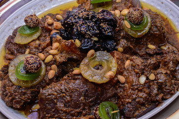 Meat dish with plum, dried pineapple and almonds. One of the most famous Moroccan dishes