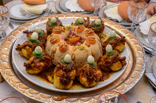 Moroccan Couscous with Tfaya, couscous with chicken and caramelized onions, almonds and boiled eggs