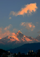 The beauty of mountain Fishtail with cloud at the time of sunrise.