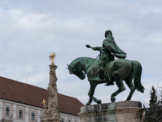 Hunyadi Statue and Holy Trinity Statue on Szechenyi square in city of Pecs Hungary Europe