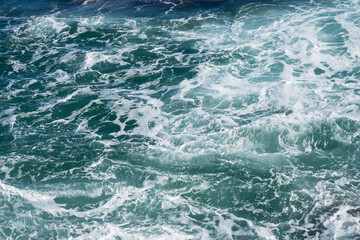 blue mediterranean sea with waves and foam natural water background