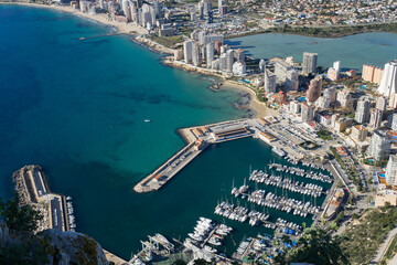 Naklejka premium aerial view of urban architecture and the marina of Calpe beautiful travel destination on the Mediterranean coast in Spain