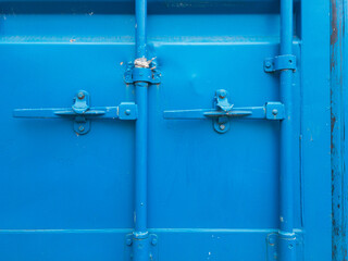 Close-up of a double door lock of a blue shipping container - 481865742