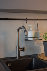 gray plumbing faucet in the interior of the kitchen