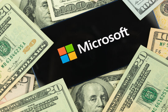 Microsoft and dollars, money, business stock and trade background