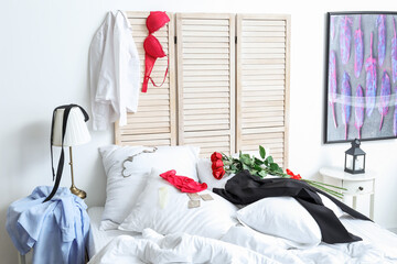 Messy bedroom after romantic date in morning