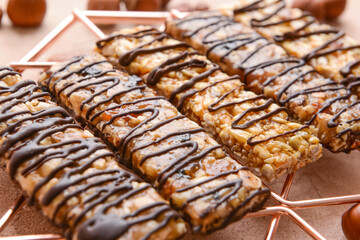 Rack with tasty chocolate nut bars, closeup