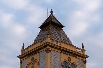 Building with colorful ornaments and roof tiles in Zsolnay Cultural Quarter in Pecs, Hungary