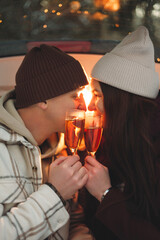 Atmospheric photo of a date in a car outdoors