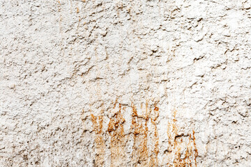 white wall background with rust residue