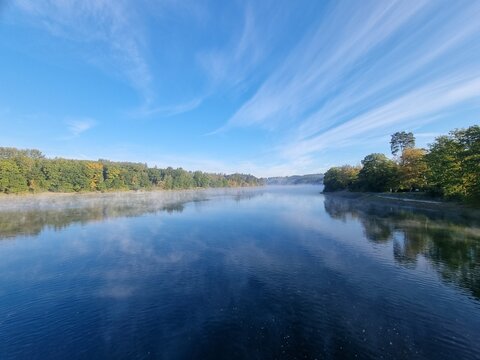 Early morning mist over the main basin of the Sorpesee (Sorpe lake), Sauerland, North Rhine-Westphalia, Germany, on a cold sunny day in October