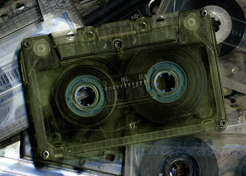 Vintage audio cassette tapes placed next to each other. Obsolete technology of audio recording and playback format audio cassette tapes,top view. 80s retro music background.  