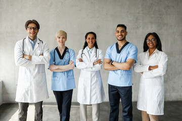 Fototapeta na wymiar Multiracial medical team posing at clinic while having team-building