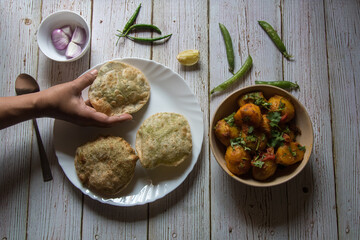 Hand of a lady serving food with use of selective focus 