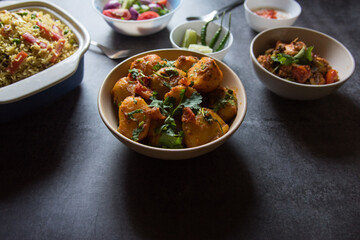 Dum aloo or potato masala in a bowl with use of selective focus