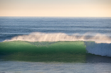 Beautiful Atlantic waves breaking in south Spain at a winter evening. Surfer swell waves breaking elegantly