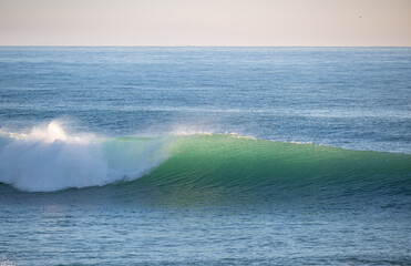 Beautiful Atlantic waves breaking in south Spain at a winter evening. Surfer swell waves breaking elegantly