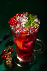 Cocktail with ice and currant