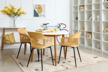 Interior of modern room with table, chairs and bicycle