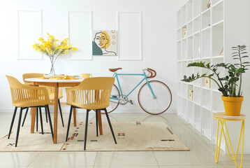 Interior of modern room with table, chairs and bicycle