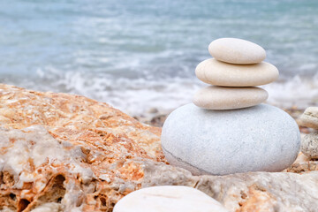 Obraz na płótnie Canvas Stack of pebbles on sea beach
