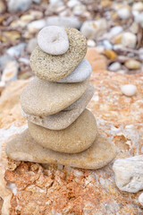 Fototapeta na wymiar Stack of pebbles on sea beach