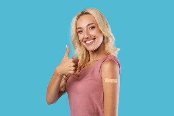 Happy Vaccinated Woman Showing Adhesive Bandage After Vaccine