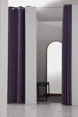 Empty dressing room in fashion store. Stylish interior