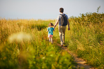 Father and daughter hiking near Mers-les-Bains, France - obrazy, fototapety, plakaty