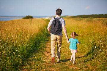 Father and daughter hiking near Mers-les-Bains, France - obrazy, fototapety, plakaty