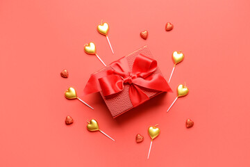 Gift for Valentine's Day and hearts on red background