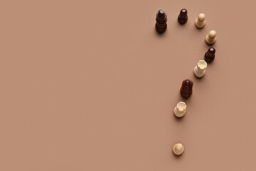 Question mark made of chess pieces on color background