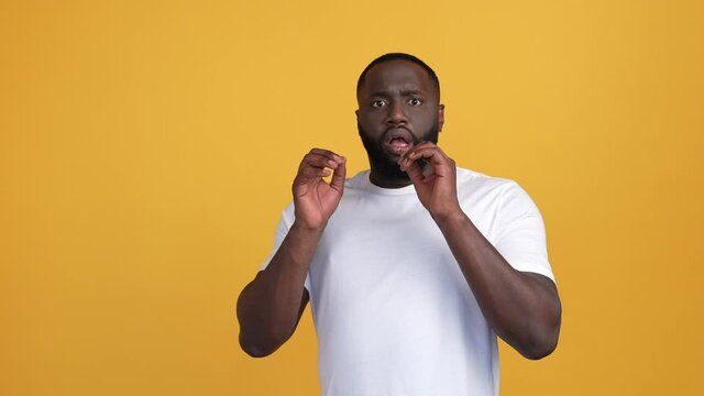 Frustrated guy hide face not see spooky news isolated bright color background